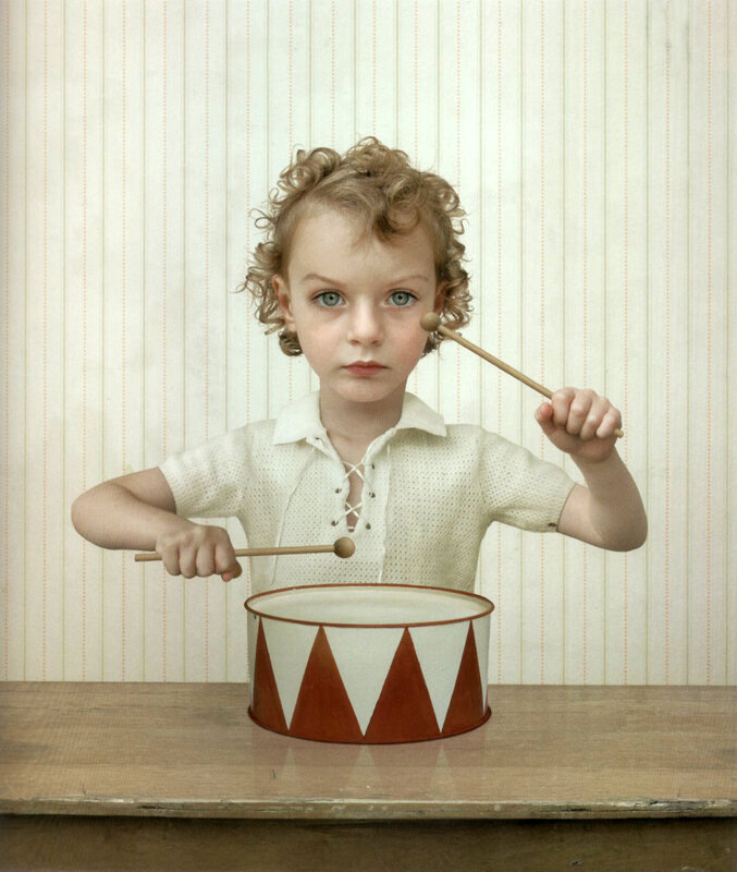 child playing toy drum