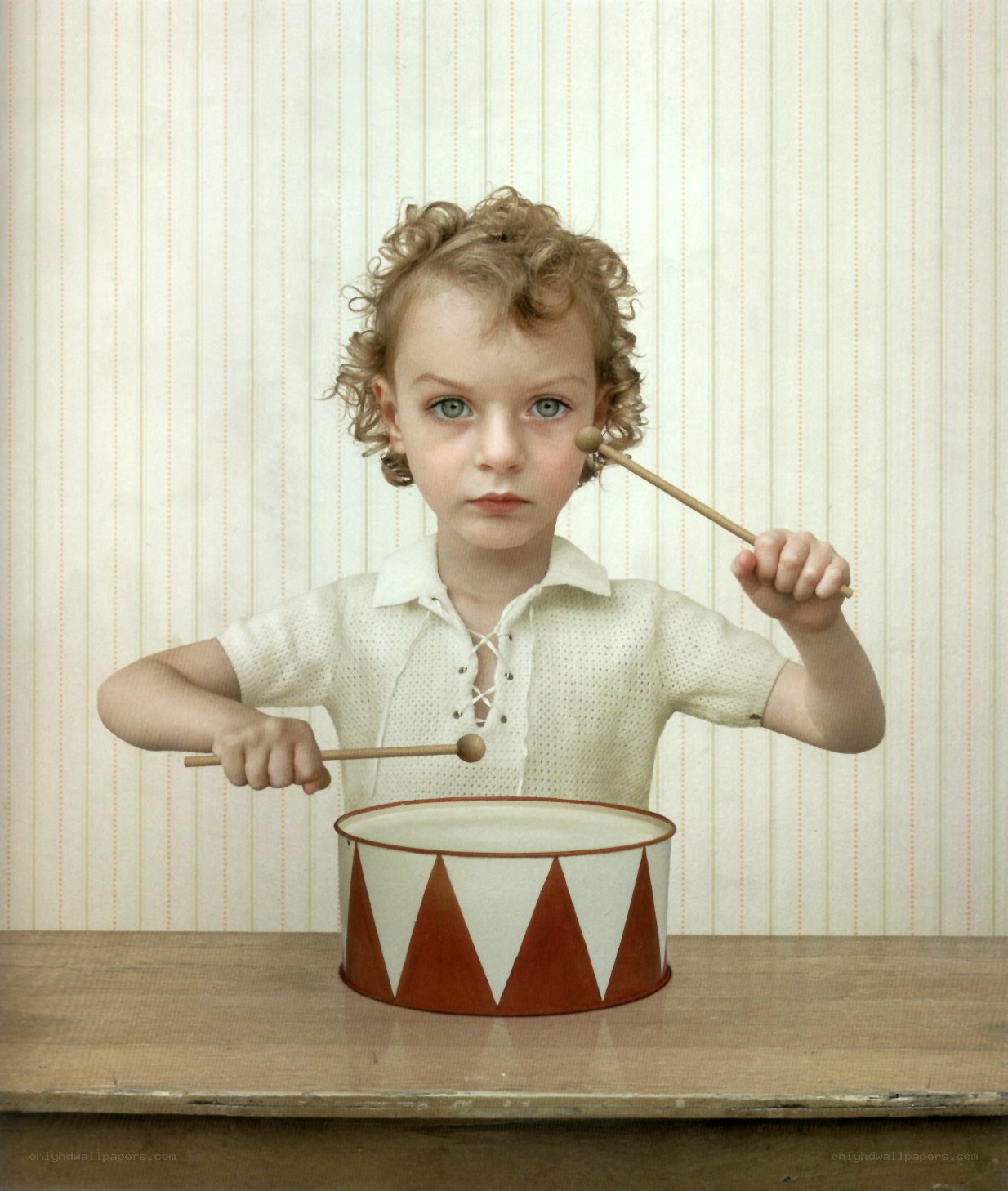 child playing toy drum