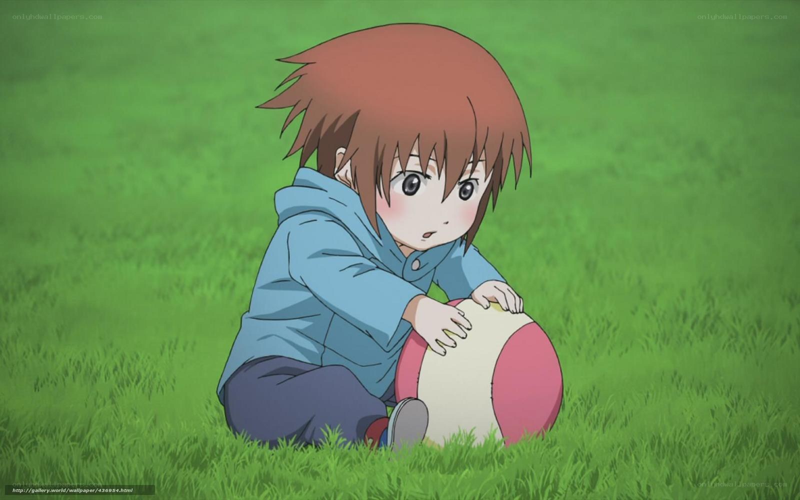 child playing with ball in grass