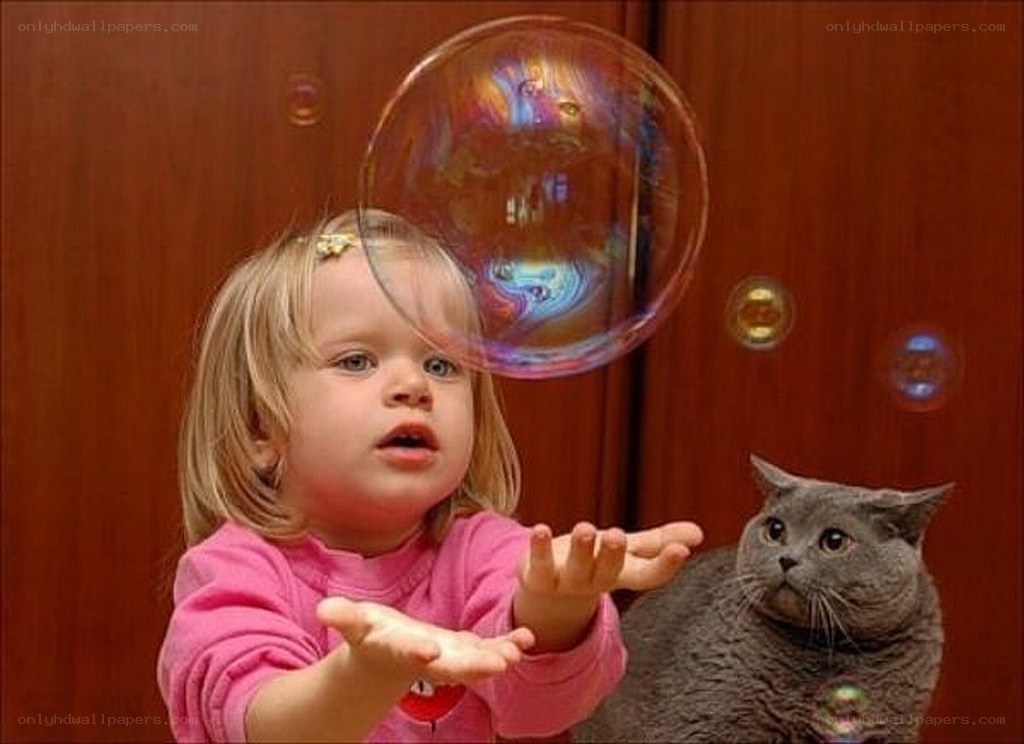 child playing with bubbles