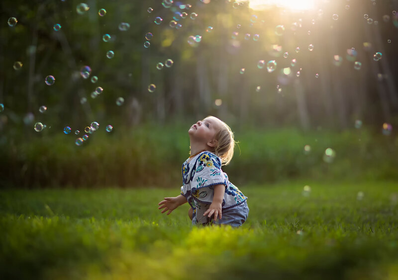 Child Playing with Bubbles — Green