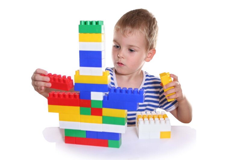 child playing with building blocks