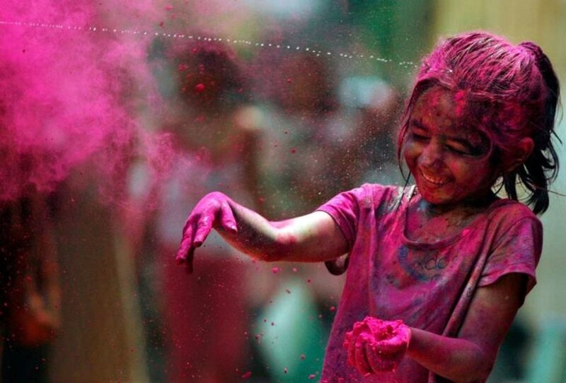 Child Playing with Colored Powder