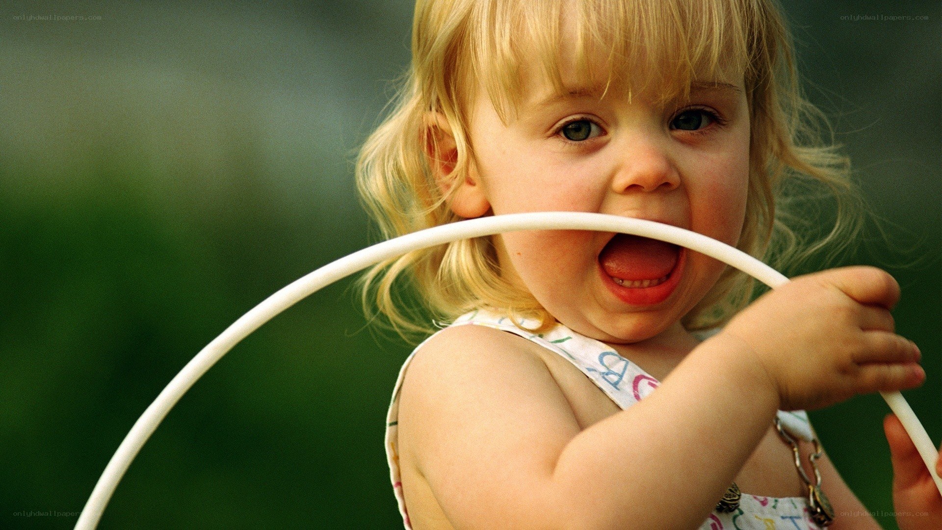 child playing with hula hoop