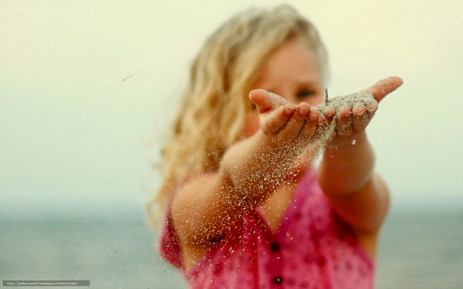 child playing with sand