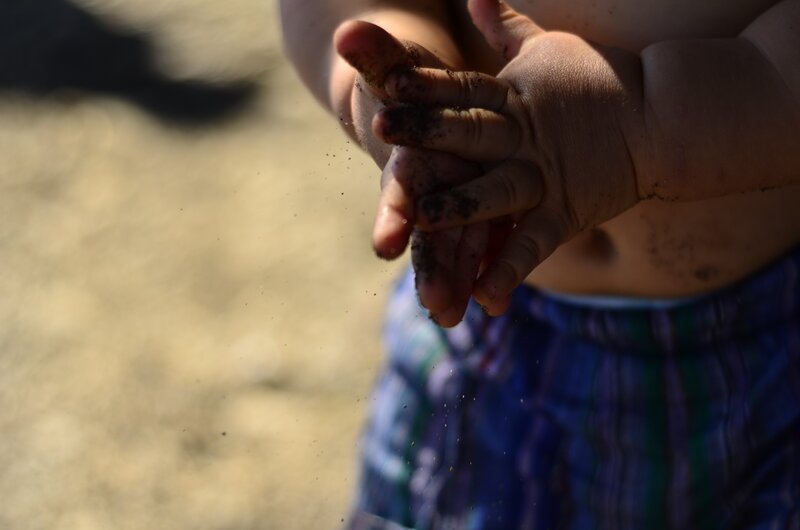 child playing with sand