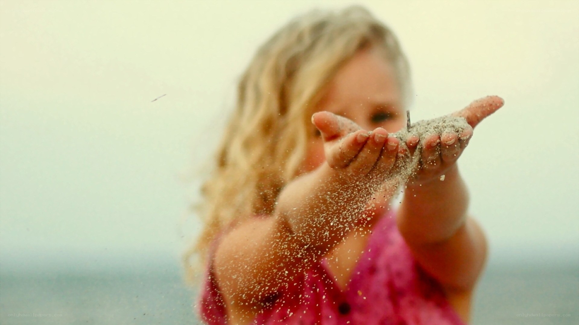 child playing with sand