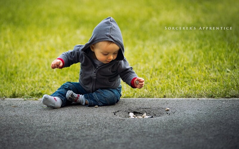 child playing with stones