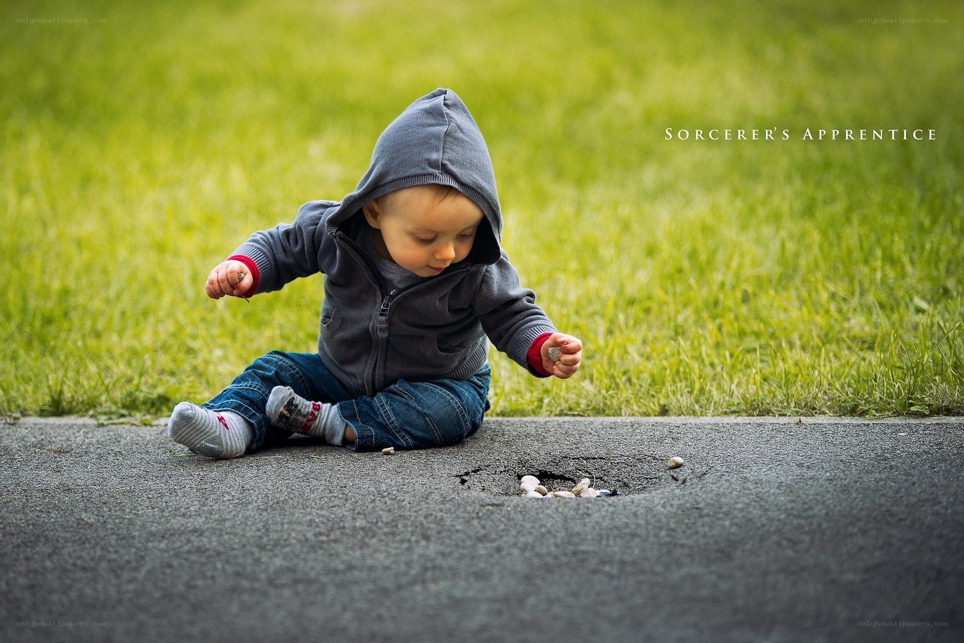 child playing with stones