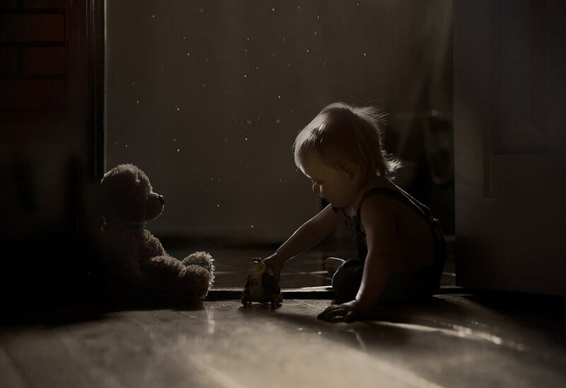Child Playing with Toys — Brown