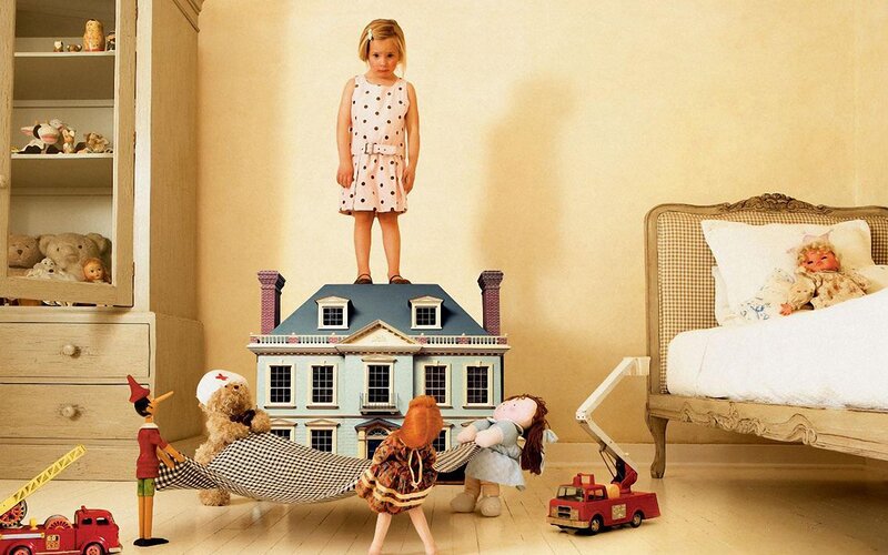 Child playing with toys in bedroom