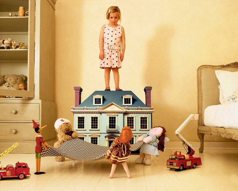 Child playing with toys in bedroom