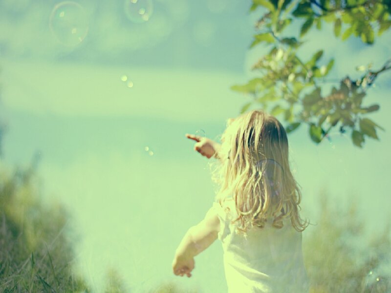 Child Pointing at Bubbles