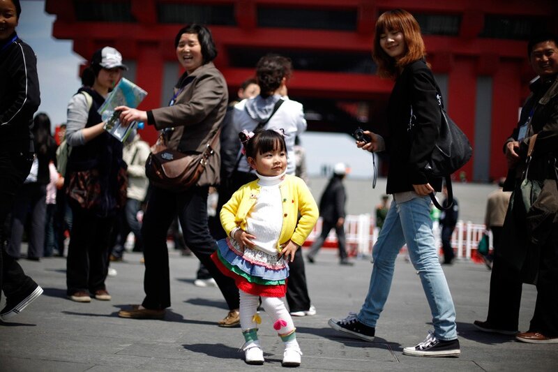 Child posing in a crowd