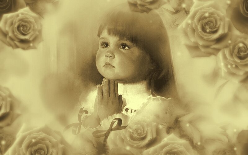 child praying among roses