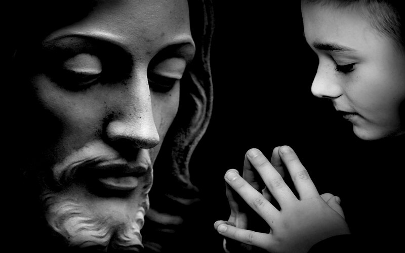 Child Praying to Statue