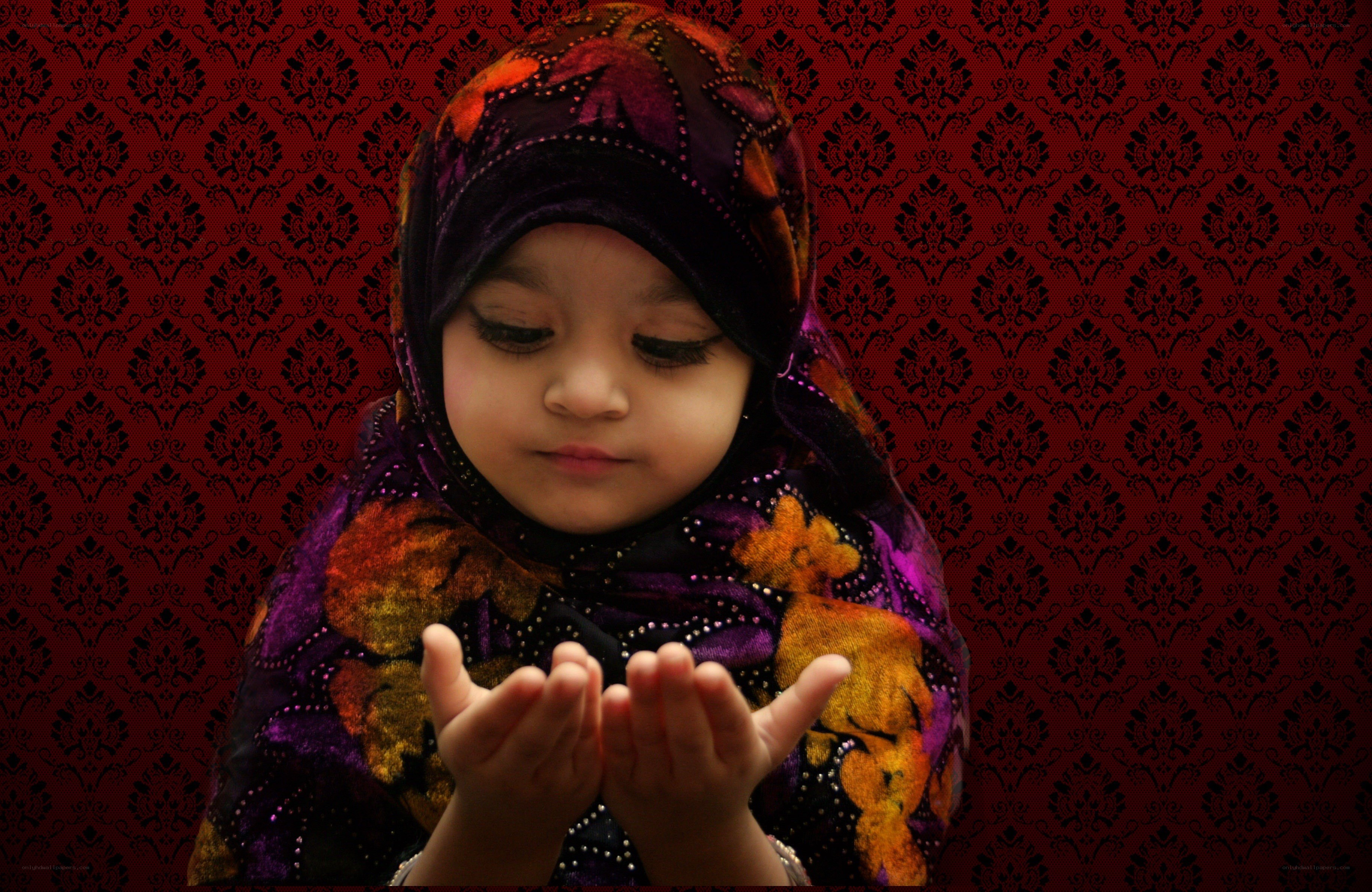 child praying with hands clasped