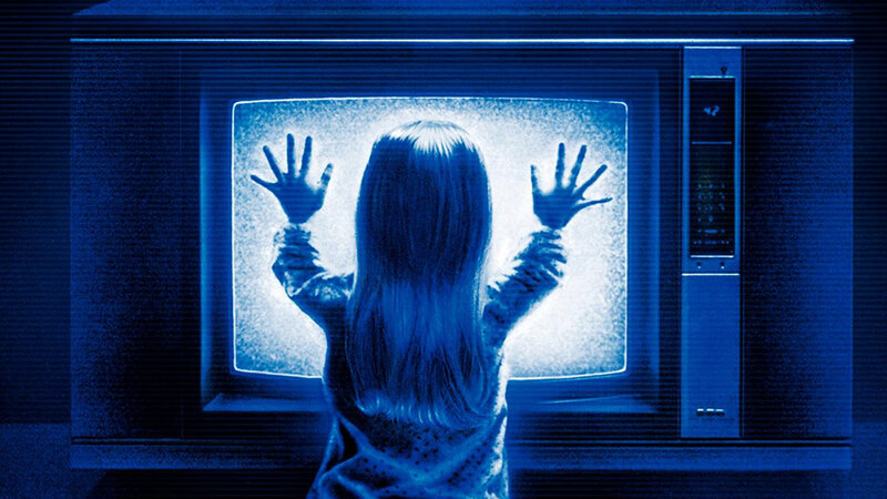 Child Pressing Hands to TV