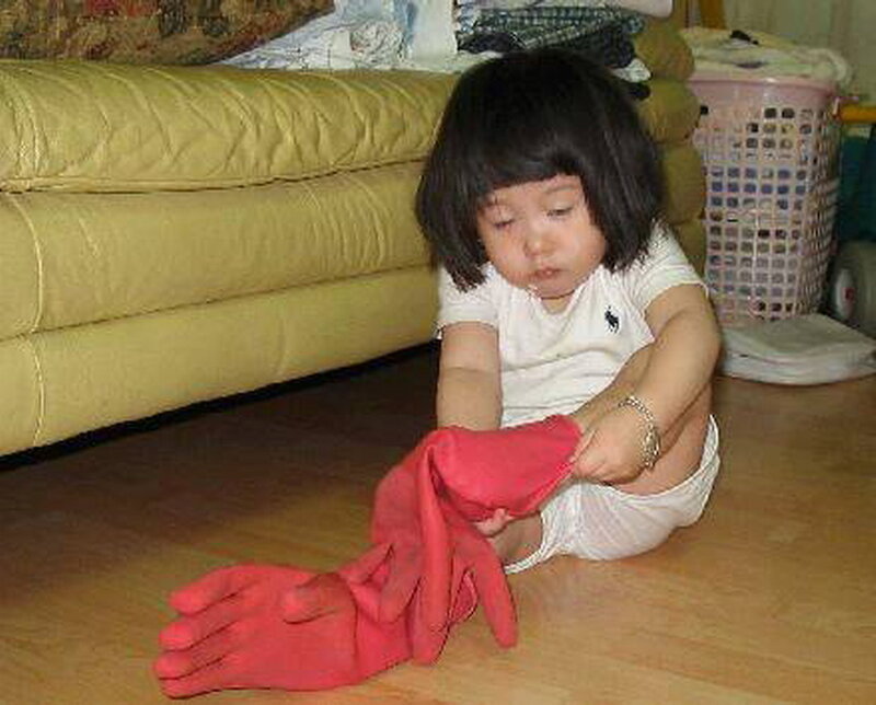 Child Putting on Gloves