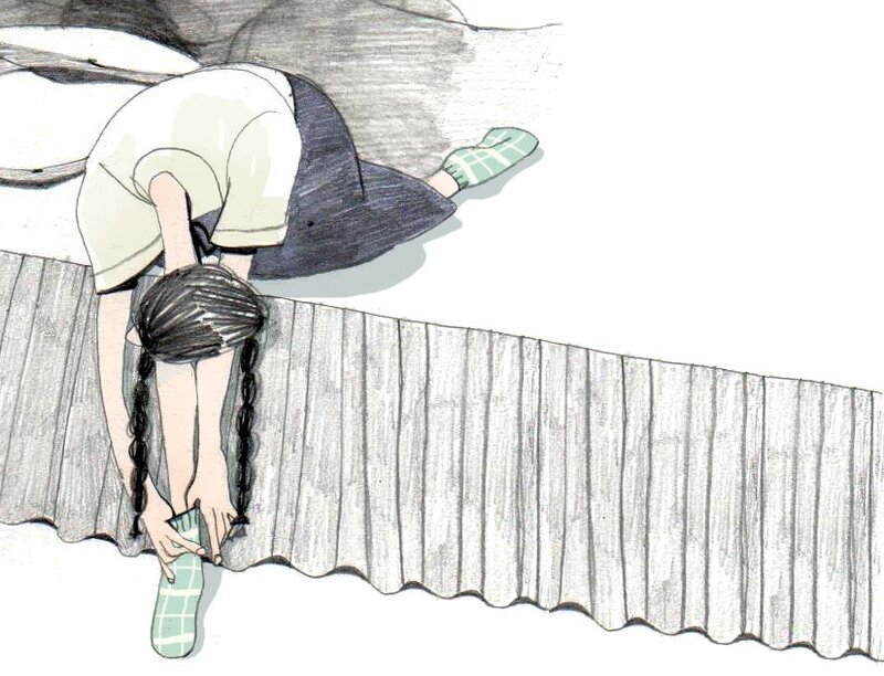 child putting on socks