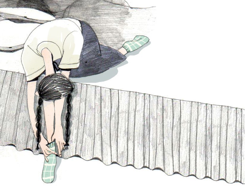 child putting on socks
