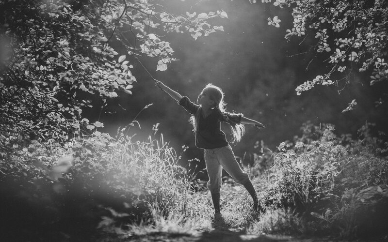 Child Reaching for Branch