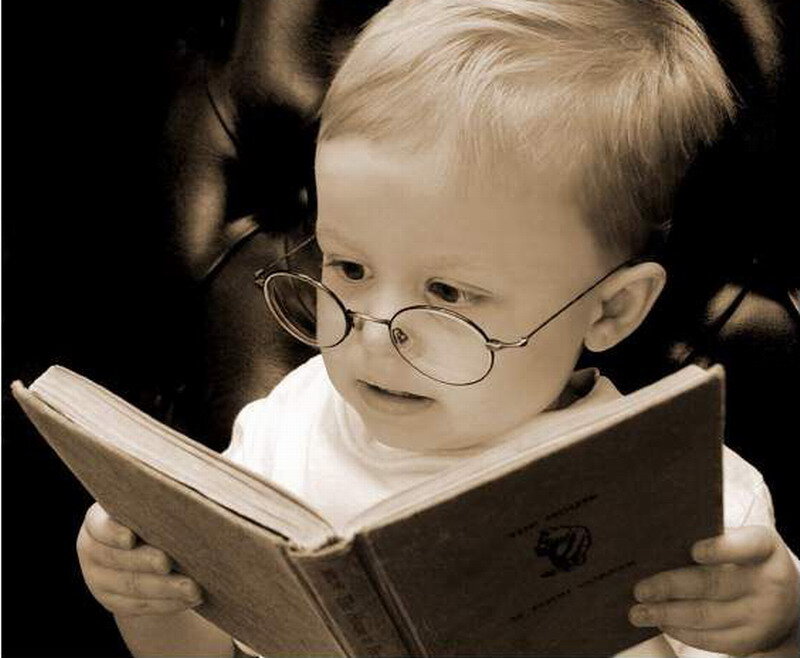 Child Reading Book — Brown