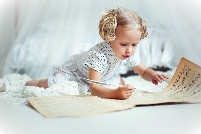 Child Reading Sheet Music