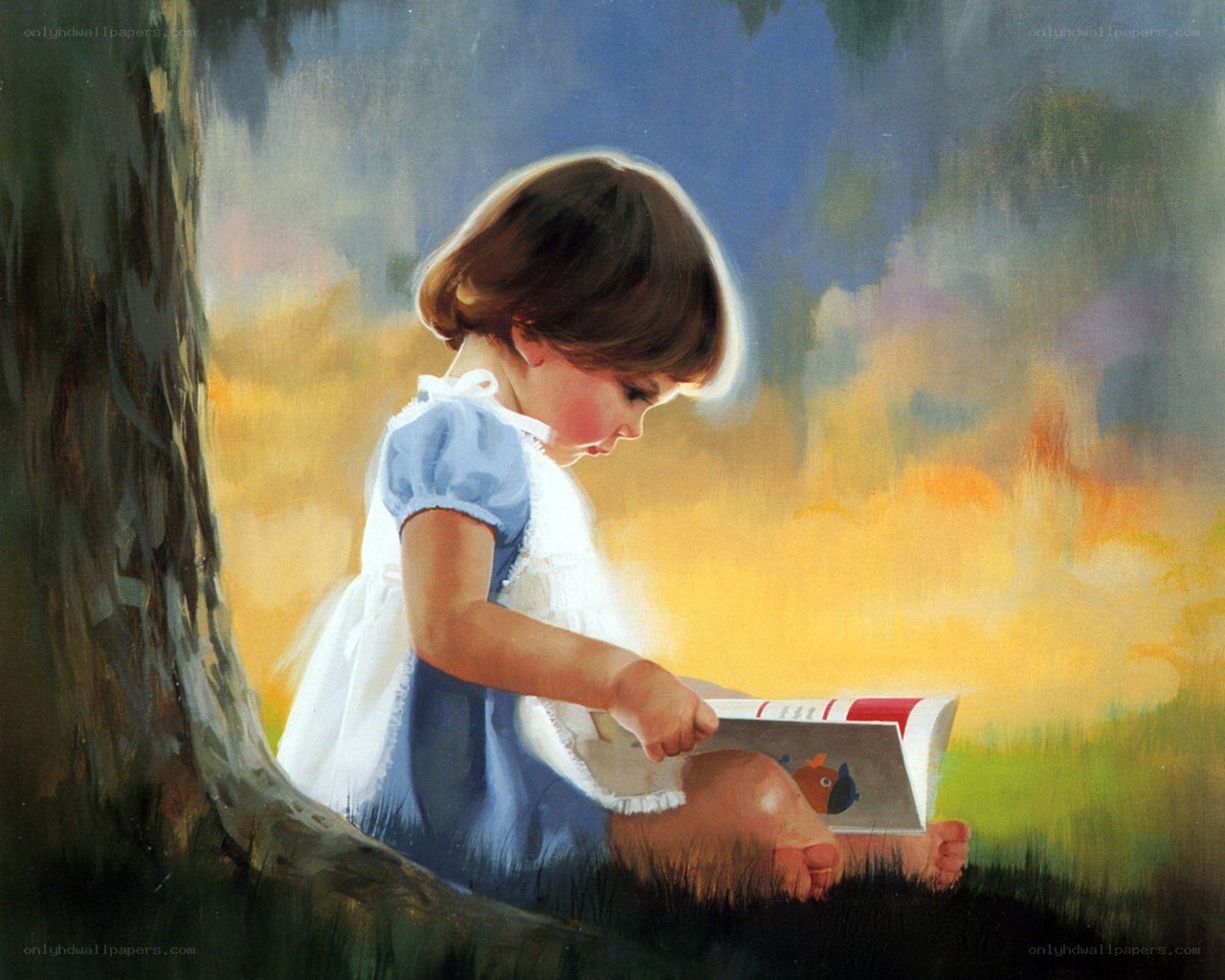 child reading under a tree