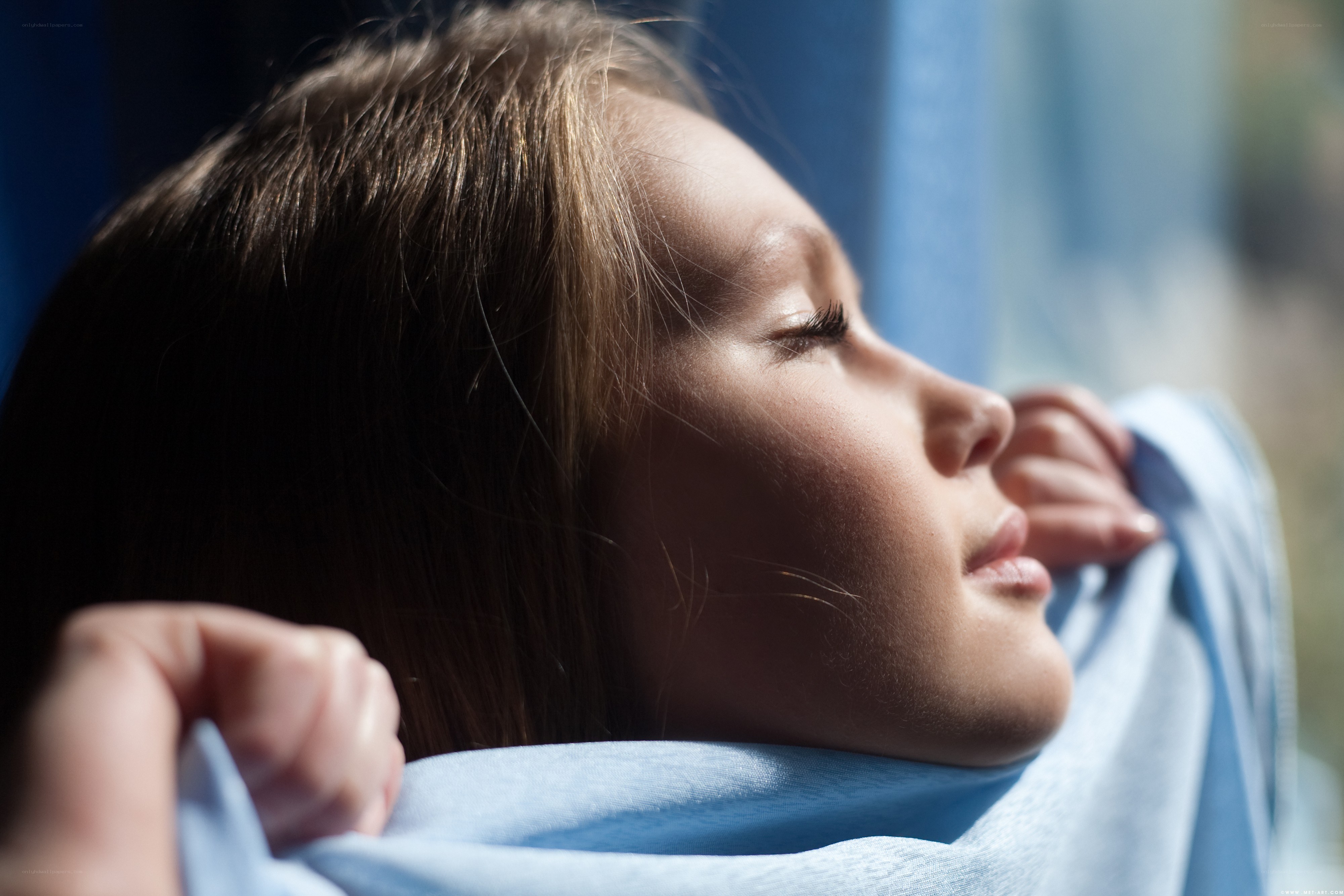 child resting by window