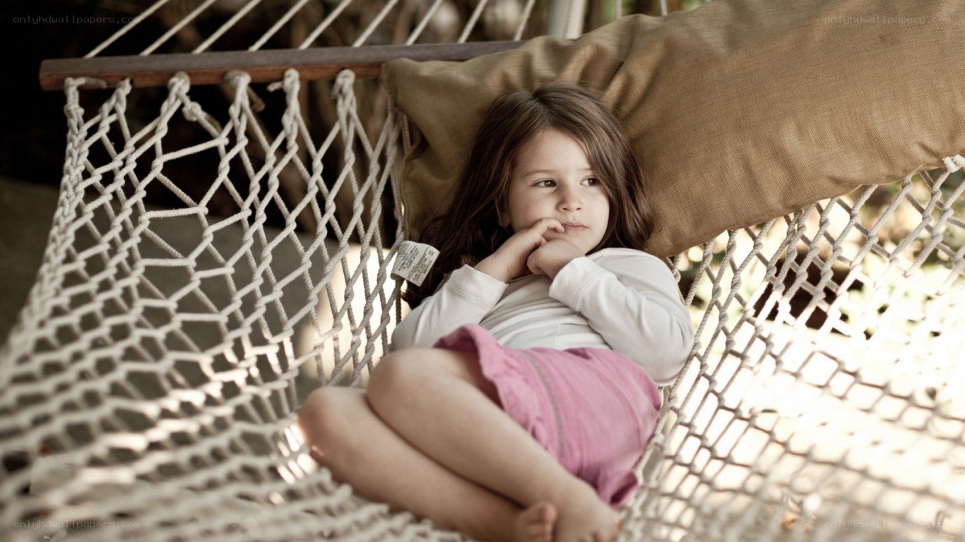 child resting in a hammock