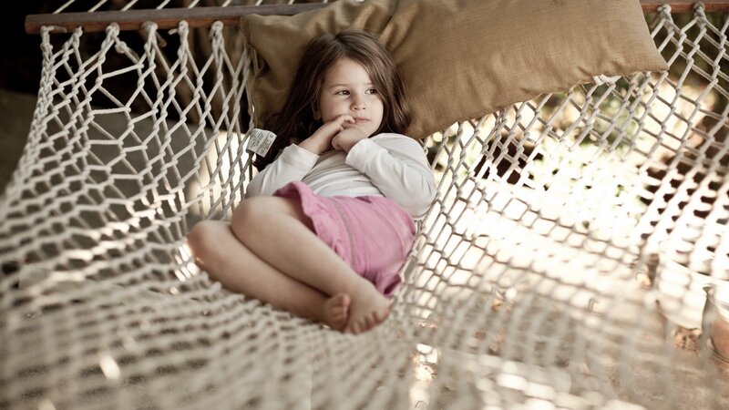 Child resting in a hammock