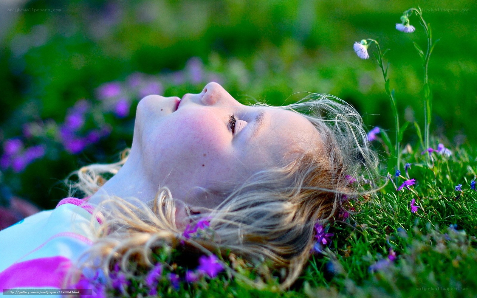 Child resting in a meadow
