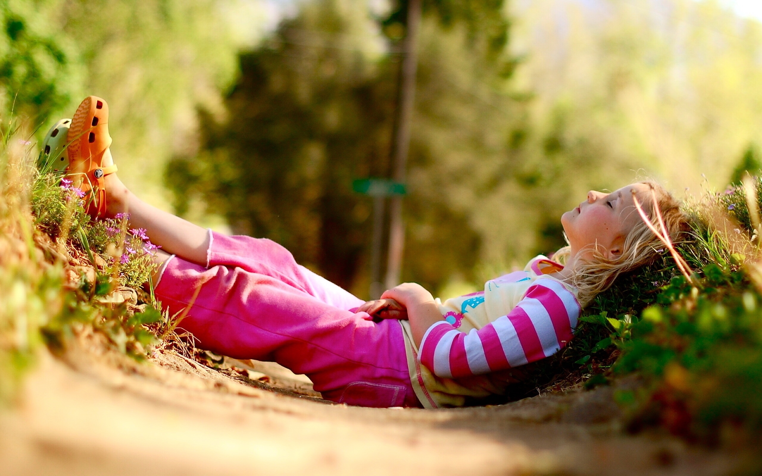 child resting in nature