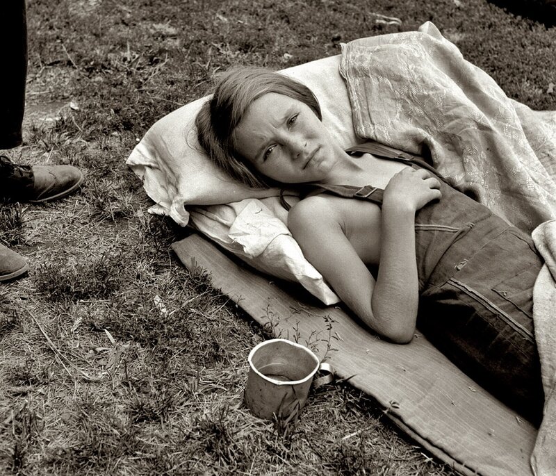 Child resting on a blanket