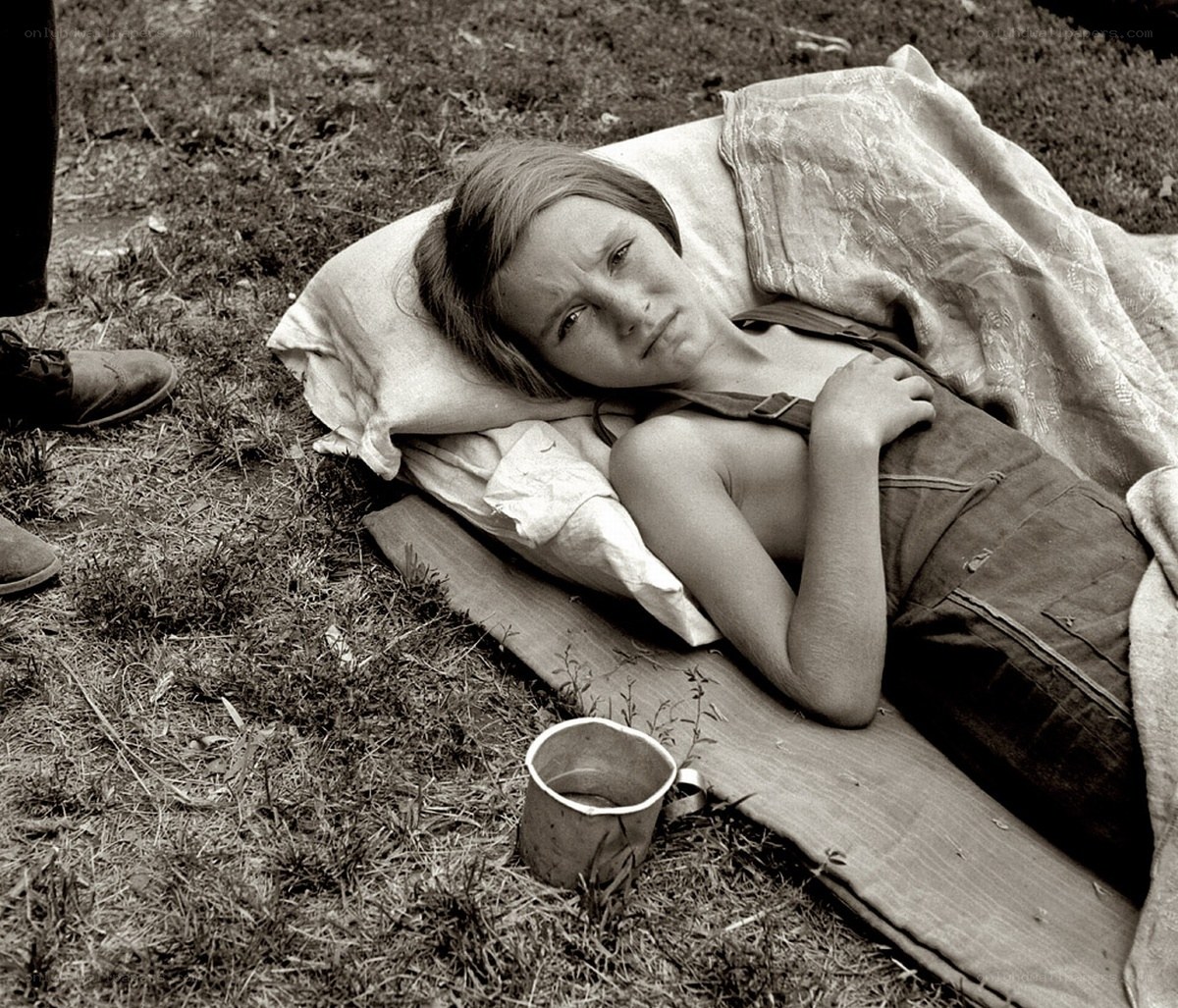 Child resting on a blanket