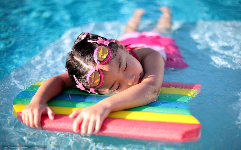 child resting on pool float