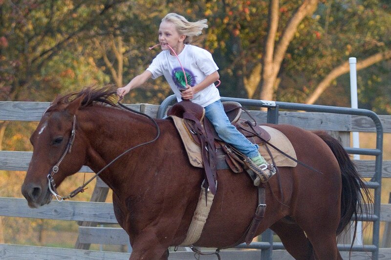 Child Riding Horse — Brown