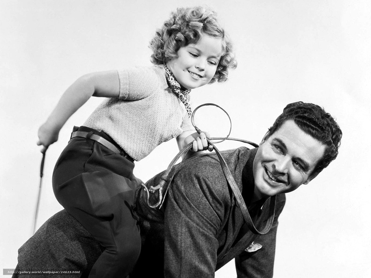 child riding on man's back