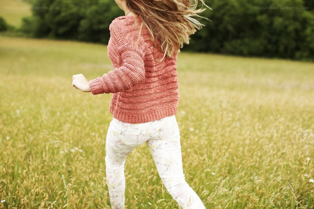 child running in a field