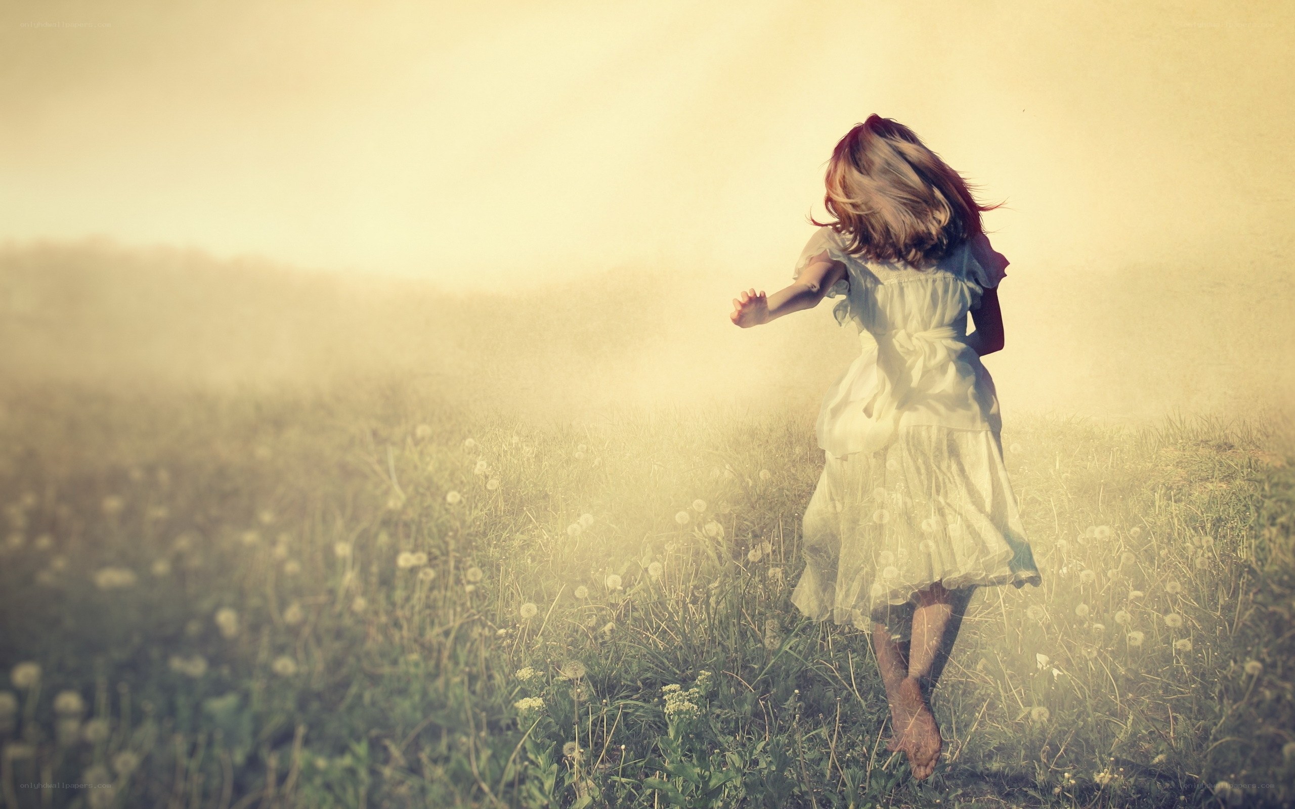 Child running in a field