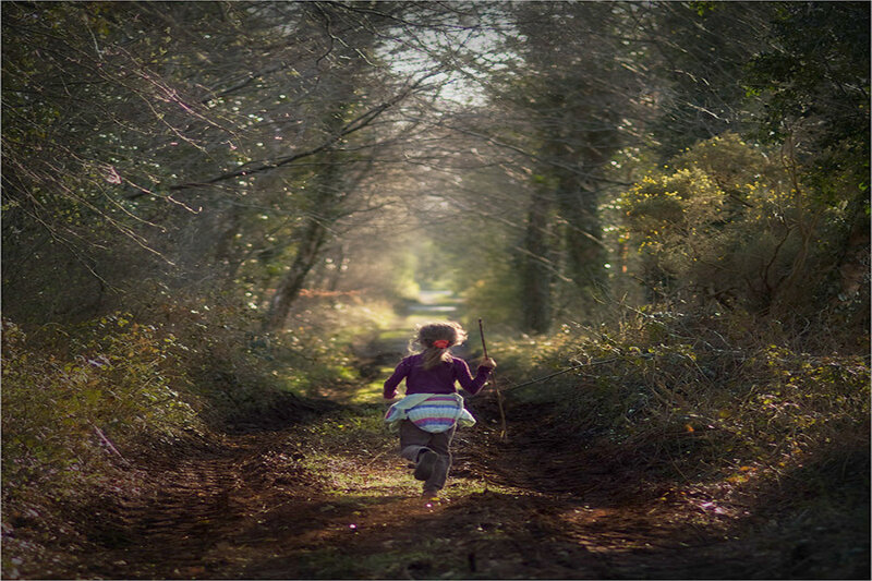 Child Running in Forest — Green