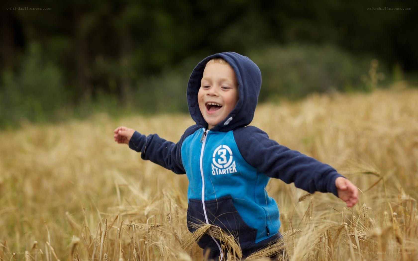 child running in wheat field