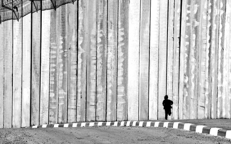 Child running near a wall