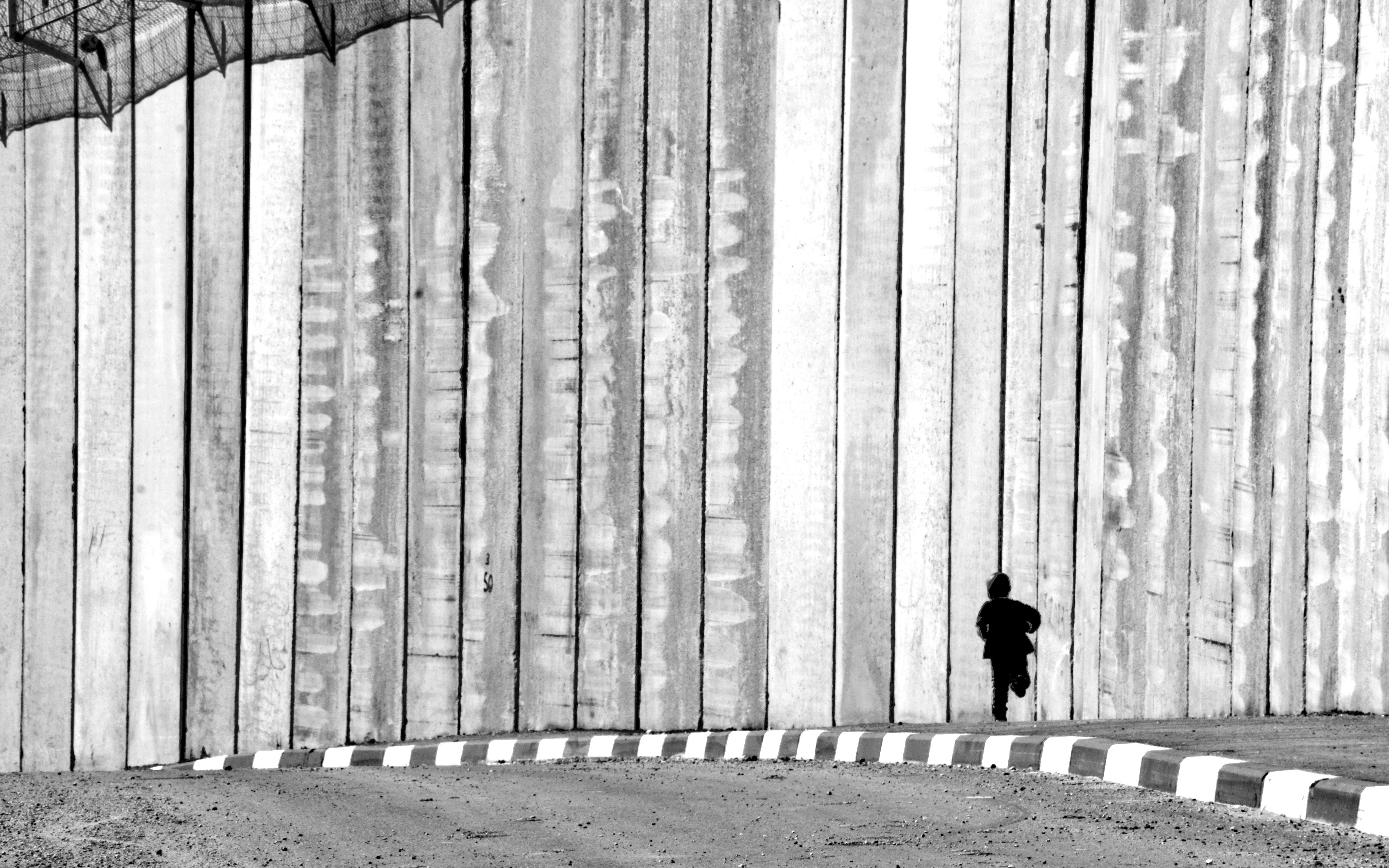 Child running near a wall