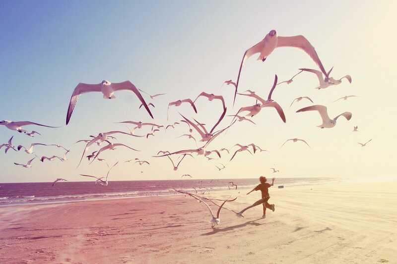Child Running on Beach — Blue, Serene, Sunset