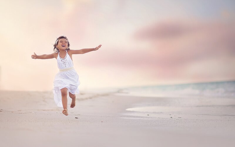 Child Running on Beach — White, Serene