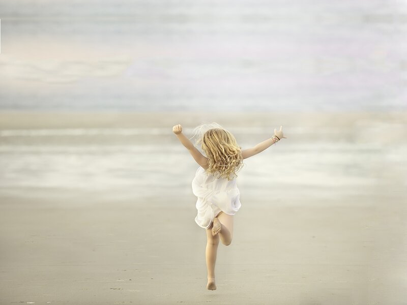 Child Running on Beach — White