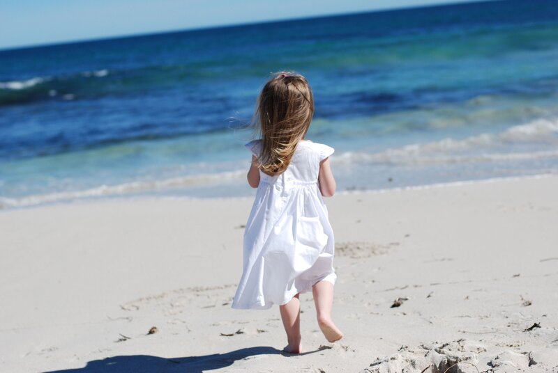 child running on the beach