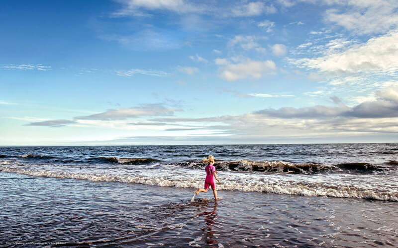 Child running on the beach